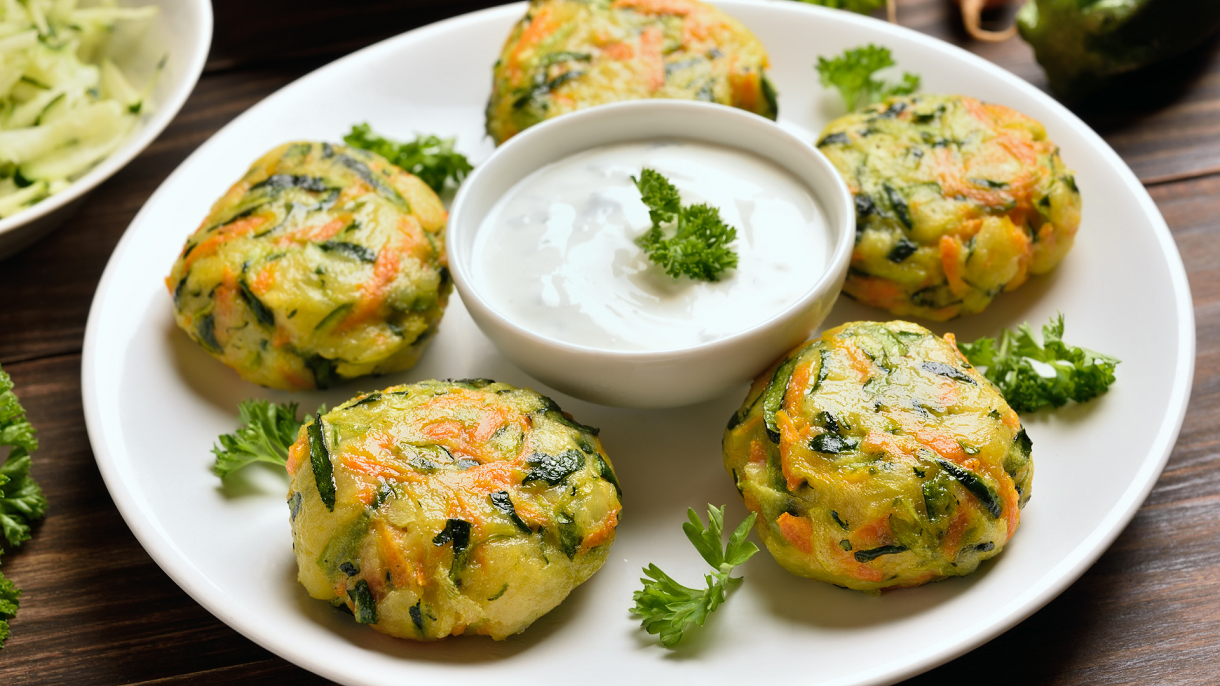 Delightful Vegan Zucchini Fritters with Creamy White Sauce and Baby Spinach Salad: A Healthy Everyday Dish.