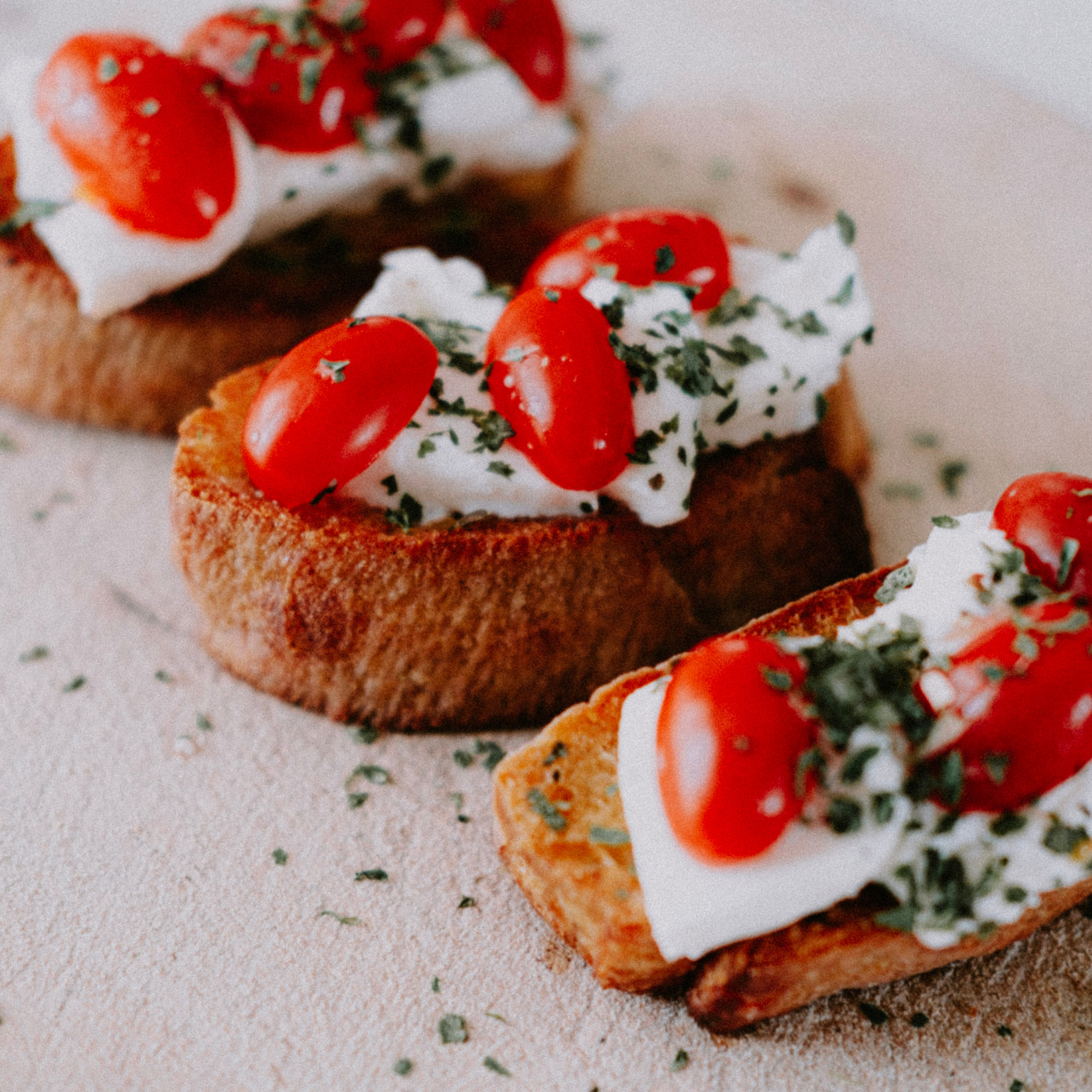 Delightful Burrata: A Symphony of Cherry Tomatoes, Baby Spinach, and Olive Oil.